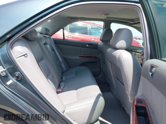 2002 Toyota Camry LE z VIN 4T1BE30KX2U591037, wystawiony jako IAAI lot #42077641 z przebiegiem 86 569 mil mil oraz . Historia ofert i sprzedaży dostępna na DreamBid. Obrazek 8.