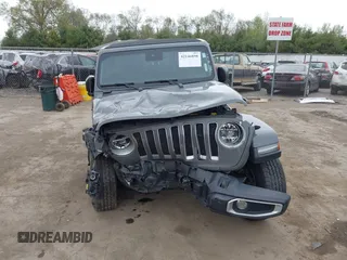 2022 Jeep Wrangler Unlimited Sahara with VIN 1C4HJXEG7NW138105, listed as a IAAI auction lot 42146898 with Not provided miles and . Bid and sale history available at DreamBid. Image 13.