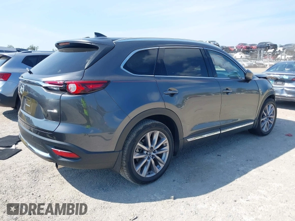 2020 Mazda CX-9 Grand Touring z VIN JM3TCADY8L0417775, wystawiony jako IAAI lot #42306864 z przebiegiem 35 287 mil mil oraz . Historia ofert i sprzedaży dostępna na DreamBid. Obrazek 4.