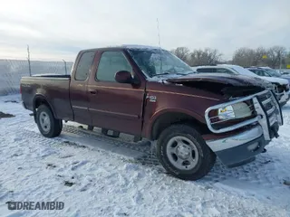 2000 Ford F-150 XL with VIN 1FTRX18L2YNA50128, listed as a IAAI auction lot 40956879 with 1 mi miles. Bid and sale history available at carsss.com. Image 1.