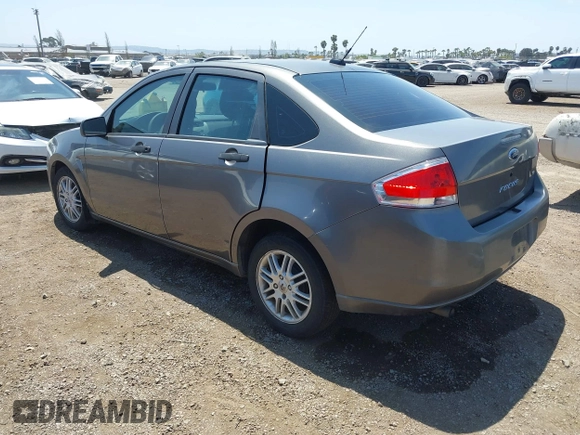 2009 Ford Focus SE with VIN 1FAHP35N69W244451, listed as a IAAI auction lot 42104982 with 199,524 mi miles. Bid and sale history available at carsss.com. Image 3.