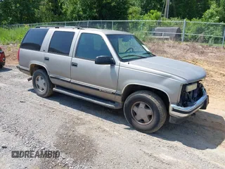 1999 Chevrolet Tahoe Z71 z VIN 1GNEK13R6XJ570371, wystawiony jako IAAI lot #42299996 z przebiegiem 205 446 mil mil oraz . Historia ofert i sprzedaży dostępna na DreamBid. Obrazek 1.
