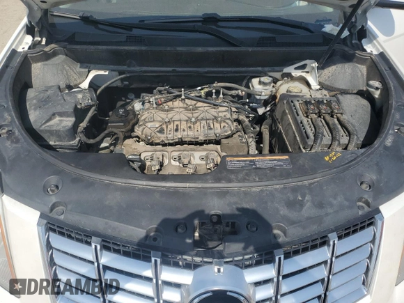 2016 Cadillac SRX Luxury Collection with VIN 3GYFNBE39GS516719, listed as a Copart auction lot 59988365 with 138,054 mi miles and Salvage title. Bid and sale history available at DreamBid. Image 12.
