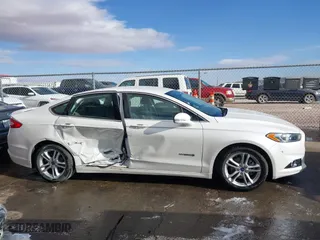 2015 Ford Fusion Titanium Hybrid with VIN 3FA6P0RU9FR308973, listed as a IAAI auction lot 41754320 with 82,686 mi miles. Bid and sale history available at carsss.com. Image 13.