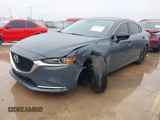 2021 Mazda 6 Carbon Edition with VIN JM1GL1WY0M1600414, listed as a IAAI auction lot 41551393 with 36,780 mi miles and . Bid and sale history available at DreamBid. Image 21.