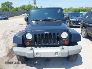 2009 Jeep Wrangler Sahara with VIN 1J4FA541X9L763737, listed as a IAAI auction lot 42721115 with 166,663 mi miles and . Bid and sale history available at DreamBid. Image 12.