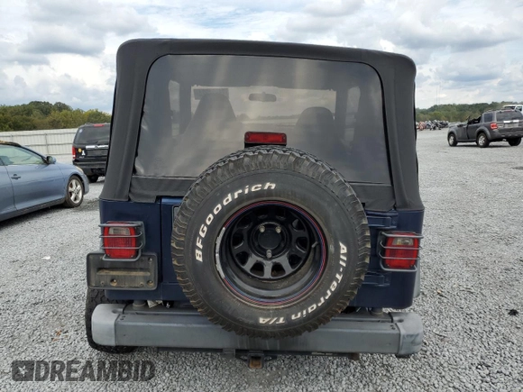 2002 Jeep Wrangler Sport with VIN 1J4FA49S62P704405, listed as a Copart auction lot 74531924 with 0 mi miles and Salvage Title. Bid and sale history available at carsss.com. Image 6.