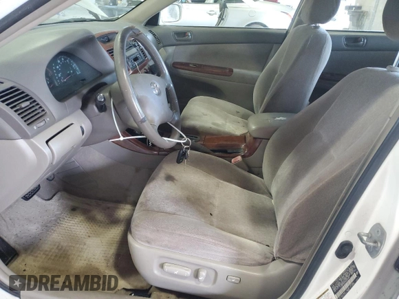 2004 Toyota Camry LE with VIN JTDBE32K940245895, listed as a Copart auction lot 63064585 with 197,467 mi miles and Clean title. Bid and sale history available at DreamBid. Image 7.