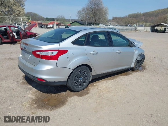 2012 Ford Focus SE with VIN 1FAHP3F2XCL217086, listed as a IAAI auction lot 42072717 with 112,549 mi miles. Bid and sale history available at carsss.com. Image 4.