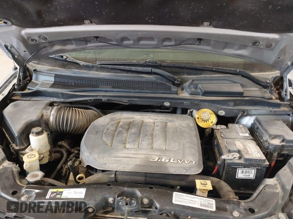 2014 Dodge Grand Caravan SXT with VIN 2C4RDGCG9ER213426, listed as a IAAI auction lot 41044553 with 175,140 mi miles and . Bid and sale history available at DreamBid. Image 10.