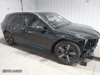 2023 BMW iX xDrive50 with VIN WB523CF04PCL15607, listed as a IAAI auction lot 41315457 with 44,058 mi miles. Bid and sale history available at carsss.com. Image 1.