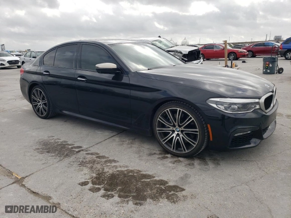 2018 BMW 5 Series M550i xDrive with VIN WBAJB9C57JB034918, listed as a Copart auction lot 51668675 with 94,492 mi miles and Clean Title. Bid and sale history available at carsss.com. Image 4.