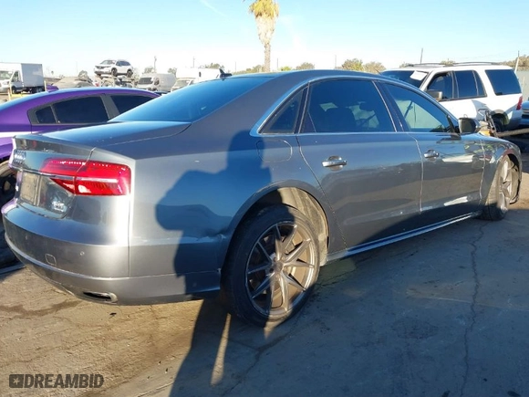 2016 Audi A8 L 4.0T Sport with VIN WAU43AFD1GN008031, listed as a IAAI auction lot 41390435 with 153,152 mi miles. Bid and sale history available at carsss.com. Image 4.