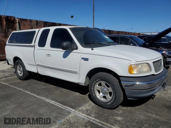 2000 Ford F-150 XL with VIN 1FTZX172XYNC01869, listed as a Copart auction lot 47414095 with 0 mi miles and Salvage Title. Bid and sale history available at carsss.com. Image 4.