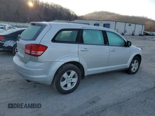 2013 Dodge Journey American Value with VIN 3C4PDCAB9DT604157, listed as a Copart auction lot 48206675 with 158,392 mi miles and Salvage Title. Bid and sale history available at DreamBid. Image 3.