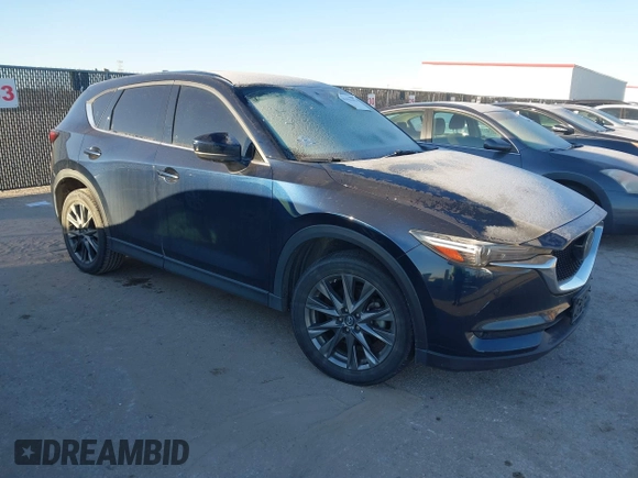 2019 Mazda CX-5 Signature with VIN JM3KFBEY5K0656965, listed as a IAAI auction lot 41421453 with 99,073 mi miles. Bid and sale history available at carsss.com. Image 1.