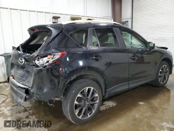 2016 Mazda CX-5 Grand Touring with VIN JM3KE4DY2G0738899, listed as a Copart auction lot 50943255 with 80,807 mi miles and Salvage Title. Bid and sale history available at carsss.com. Image 3.