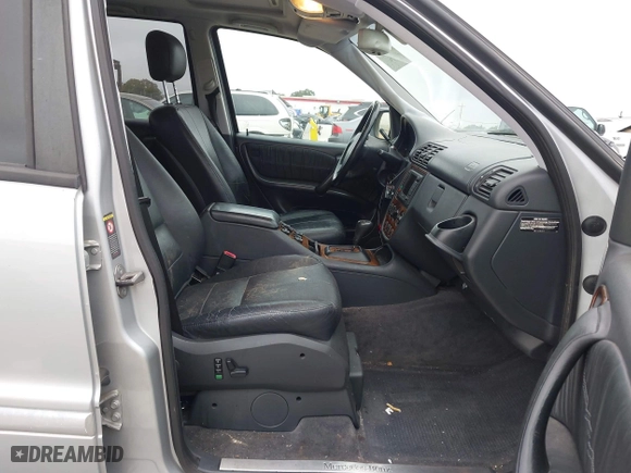 2001 Mercedes-Benz M-Class with VIN 4JGAB54E71A231597, listed as a IAAI auction lot 42058829 with 233,005 mi miles. Bid and sale history available at carsss.com. Image 5.