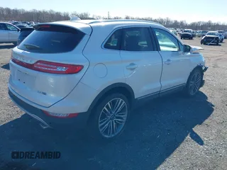 2015 Lincoln MKC with VIN 5LMTJ2AH8FUJ31911, listed as a IAAI auction lot 41735017 with 76,332 mi miles. Bid and sale history available at carsss.com. Image 4.