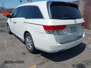 2015 Honda Odyssey EX-L with VIN 5FNRL5H67FB017554, listed as a IAAI auction lot 41974821 with 76,130 mi miles and . Bid and sale history available at carsss.com. Image 3.