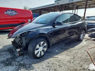 2021 Tesla Model Y Standard Range z VIN 5YJYGDED9MF103152, wystawiony jako Copart lot #58180205 z przebiegiem 46 737 mil mil oraz Nie do naprawy • Non repairable. Historia ofert i sprzedaży dostępna na DreamBid. Obrazek 1.