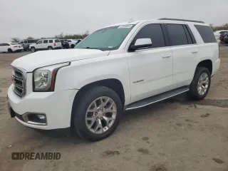 2015 GMC Yukon SLE with VIN 1GKS1AKC8FR733084, listed as a Copart auction lot 82960064 with 163,576 mi miles and Salvage Title. Bid and sale history available at carsss.com. Image 1.