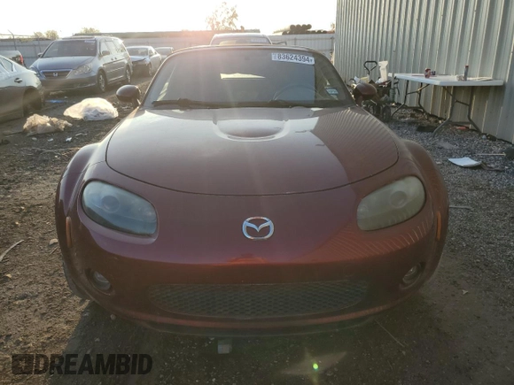 2007 Mazda MX-5 Miata Sport z VIN JM1NC25F970124896, wystawiony jako Copart lot #83624394 z przebiegiem 62 735 mil mil oraz Szkoda całkowita • Salvage title. Historia ofert i sprzedaży dostępna na DreamBid. Obrazek 5.