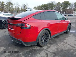 2022 Tesla Model X Plaid with VIN 7SAXCBE60NF330246, listed as a IAAI auction lot 41477394 with 51,612 mi miles and . Bid and sale history available at carsss.com. Image 4.