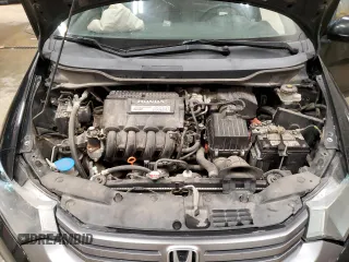 2010 Honda Insight EX z VIN JHMZE2H72AS009647, wystawiony jako Copart lot #60079205 z przebiegiem 157 844 mil mil oraz Czysty tytuł • Clean title. Historia ofert i sprzedaży dostępna na DreamBid. Obrazek 11.
