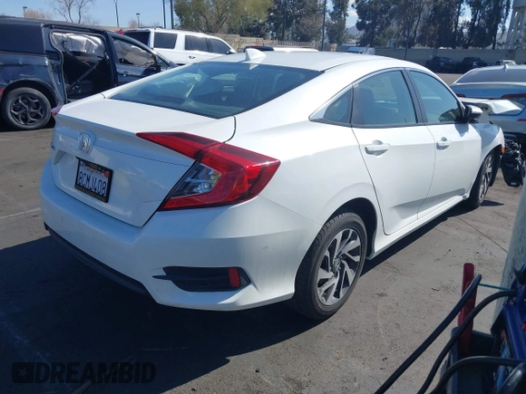 2018 Honda Civic EX with VIN 2HGFC2F71JH502564, listed as a IAAI auction lot 41933157 with 56,696 mi miles and . Bid and sale history available at DreamBid. Image 4.