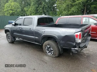 2020 Toyota Tacoma SR5 with VIN 3TMDZ5BN2LM097782, listed as a Copart auction lot 61573465 with 57,321 mi miles and Salvage title. Bid and sale history available at DreamBid. Image 2.