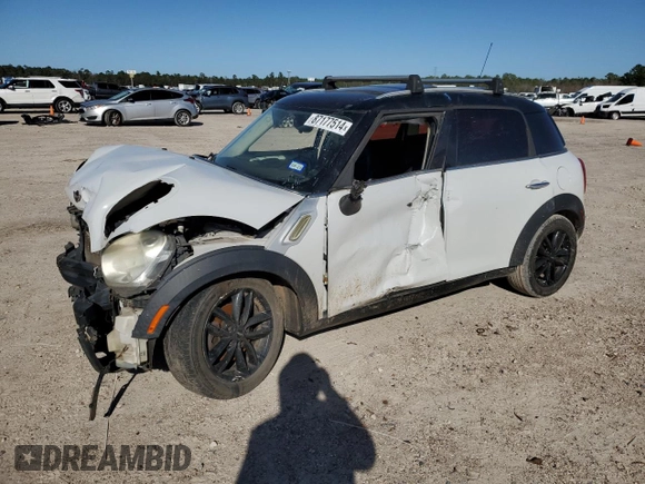 2011 MINI Countryman with VIN WMWZB3C59BWH94541, listed as a Copart auction lot 87177514 with 186,979 mi miles and Salvage title. Bid and sale history available at DreamBid. Image 1.