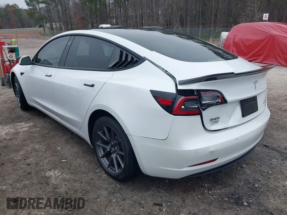 2021 Tesla Model 3 Long Range z VIN 5YJ3E1EB9MF014985, wystawiony jako IAAI lot #41672208 z przebiegiem 52 222 mil mil oraz . Historia ofert i sprzedaży dostępna na DreamBid. Obrazek 3.