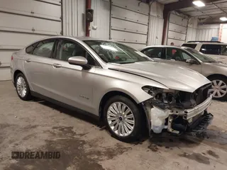 2015 Ford Fusion S Hybrid with VIN 3FA6P0UU1FR143878, listed as a IAAI auction lot 41469936 with 128,370 mi miles. Bid and sale history available at carsss.com. Image 1.
