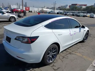 2020 Tesla Model 3 Standard Range Plus with VIN 5YJ3E1EA4LF805205, listed as a IAAI auction lot 41850744 with Not Provided miles. Bid and sale history available at carsss.com. Image 4.