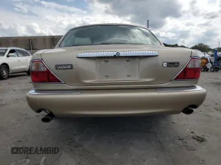 1999 Jaguar XJ z VIN SAJKX6048XC849376, wystawiony jako Copart lot #70538064 z przebiegiem 122 891 mil mil oraz Szkoda całkowita • Salvage title. Historia ofert i sprzedaży dostępna na DreamBid. Obrazek 6.