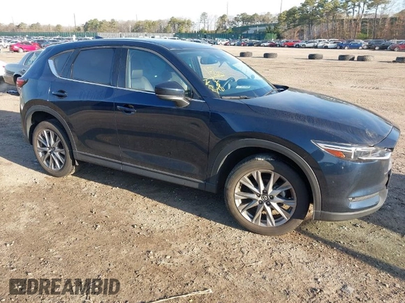 2020 Mazda CX-5 Grand Touring with VIN JM3KFBDM4L0779284, listed as a IAAI auction lot 42060936 with 9,227 mi miles. Bid and sale history available at carsss.com. Image 1.