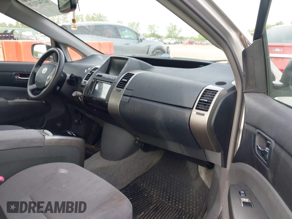 2007 Toyota Prius z VIN JTDKB20U173284944, wystawiony jako IAAI lot #42343170 z przebiegiem 172 776 mil mil oraz . Historia ofert i sprzedaży dostępna na DreamBid. Obrazek 5.