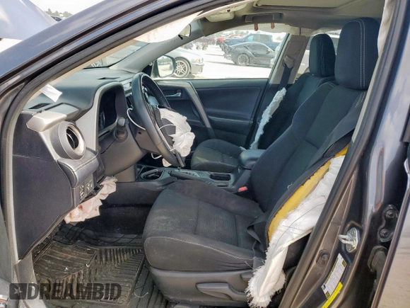 2018 Toyota RAV4 XLE with VIN 2T3WFREV2JW409292, listed as a Copart auction lot 61577355 with 189,258 mi miles and Salvage title. Bid and sale history available at DreamBid. Image 7.