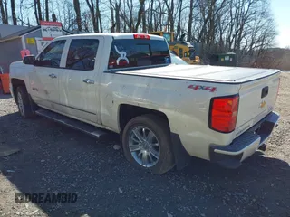 2014 Chevrolet Silverado 1500 High Country with VIN 3GCUKTEJ7EG372338, listed as a IAAI auction lot 41849096 with 69,010 mi miles and . Bid and sale history available at DreamBid. Image 3.