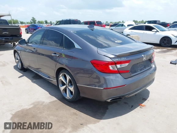 2019 Honda Accord Touring with VIN 1HGCV2F93KA013002, listed as a IAAI auction lot 42519920 with 76,841 mi miles and . Bid and sale history available at DreamBid. Image 3.