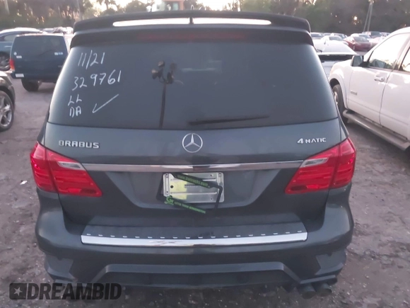 2014 Mercedes-Benz GL-Class GL 550 with VIN 4JGDF7DE9EA329761, listed as a IAAI auction lot 41651533 with 113,056 mi miles. Bid and sale history available at carsss.com. Image 16.