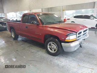 1999 Dodge Dakota SLT z VIN 1B7GL22X9XS165748, wystawiony jako IAAI lot #42242480 z przebiegiem 103 319 mil mil oraz . Historia ofert i sprzedaży dostępna na DreamBid. Obrazek 1.