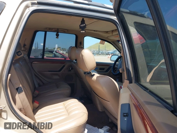 1999 Jeep Grand Cherokee Limited with VIN 1J4GW68N2XC654713, listed as a IAAI auction lot 42115829 with 195,988 mi miles. Bid and sale history available at carsss.com. Image 8.