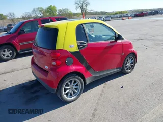 2009 Smart fortwo Pure z VIN WMEEJ31X99K290533, wystawiony jako IAAI lot #42198999 z przebiegiem 50 608 mil mil oraz . Historia ofert i sprzedaży dostępna na DreamBid. Obrazek 4.