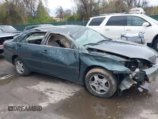 2002 Toyota Camry XLE z VIN 4T1BF32K02U522335, wystawiony jako IAAI lot #42037459 z przebiegiem 214 832 mil mil oraz . Historia ofert i sprzedaży dostępna na DreamBid. Obrazek 13.