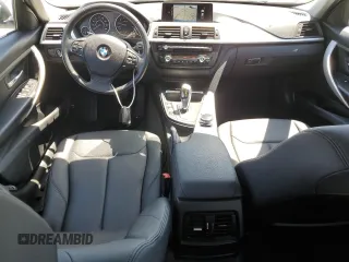 2014 BMW 3 Series 320i with VIN WBA3B1C55EK133687, listed as a Copart auction lot 63049945 with 95,604 mi miles and Salvage title. Bid and sale history available at DreamBid. Image 8.