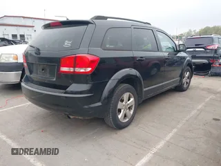 2014 Dodge Journey SE with VIN 3C4PDCAB0ET116863, listed as a IAAI auction lot 41950773 with 183,866 mi miles. Bid and sale history available at carsss.com. Image 4.