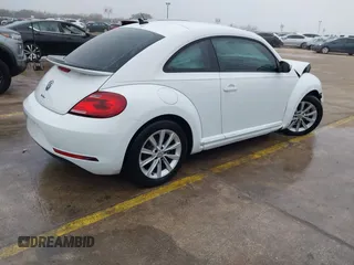 2018 Volkswagen Beetle S with VIN 3VWFD7AT3JM703443, listed as a IAAI auction lot 41437909 with 76,757 mi miles. Bid and sale history available at carsss.com. Image 4.
