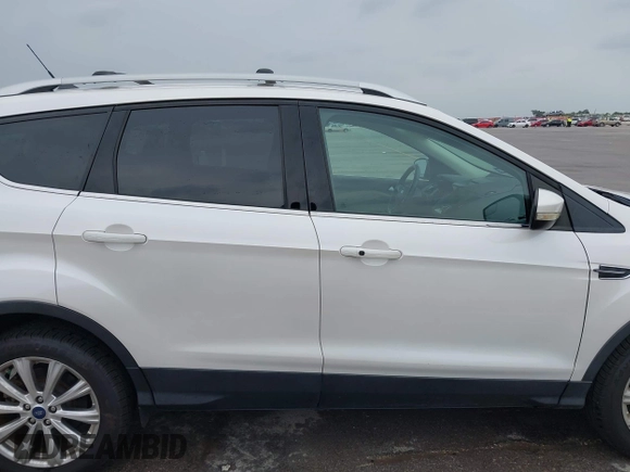 2018 Ford Escape Titanium with VIN 1FMCU9J98JUB87867, listed as a IAAI auction lot 42300123 with 48,357 mi miles and . Bid and sale history available at DreamBid. Image 13.